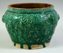 A CHINESE GREEN GLAZED TWIN HANDLE POTTERY JARDINIERE, with raised decoration depicting a dragon and