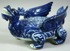 A CHINESE BLUE AND WHITE PORCELAIN MODEL OF DRAGON-LIKE BEAST, the winged creature decorated with