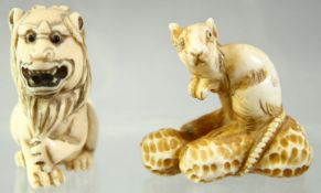 A JAPANESE CARVED IVORY NETSUKE of a rat seated on a group of nuts, together with a netsuke of a