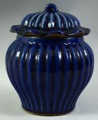 A CHINESE SACRIFICIAL BLUE GLAZE RIBBED JAR AND COVER, 26.5cm high.
