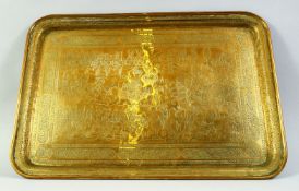 A FINE LARGE 19TH CENTURY PERSIAN QAJAR ENGRAVED BRASS TRAY, depicting a battle scene, signed to the