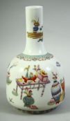 A CHINESE FAMILLE ROSE PORCELAIN VASE, decorated with flora and an array of various objects, the