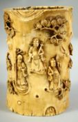 A CHINESE CARVED IVORY TUSK BRUSH POT, carved with immortals and other figures amongst