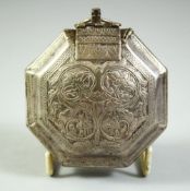 AN ISLAMIC WHITE METAL OCTAGONAL QURAN AMULET BOX, possibly silver, 7.5cm diameter.