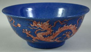 A CHINESE SPECKLED BLUE AND CORAL RED PORCELAIN BOWL, decorated with dragons and the flaming pearl