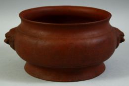 AN UNUSUAL LARGE CHINESE YIXING CENSER, with twin lion dog handles, the base with impressed six