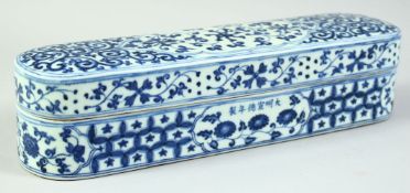 A LARGE CHINESE BLUE AND WHITE PORCELAIN PEN BOX, decorated with floral and vine motifs, bearing a