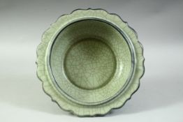 A LARGE CHINESE CELADON CRACKLE GLAZE BOWL, with petal formed rim, 21.5cm diameter.