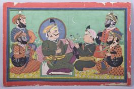 A LARGE INDIAN PAINTING ON PAPER, of a group of male figures participating in a ceremonial ritual in