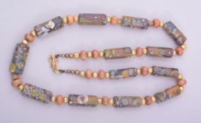 A MIDDLE EASTERN BEADED NECKLACE.
