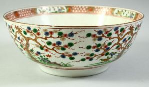 A LARGE CHINESE FAMILLE VERTE / CORAL RED PORCELAIN BOWL, painted with trees and flora, 31cm