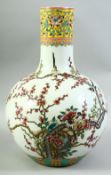 A LARGE CHINESE FAMILLE ROSE PORCELAIN BULBOUS VASE, the body decorated with birds upon a prunus