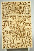 A CHINESE CANTON CARVED IVORY CARD CASE, finely carved with busy village scenes, 10.5cm x 6.5cm.