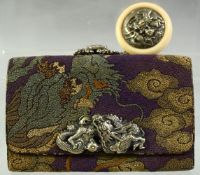 A JAPANESE WOVEN CLOTH PURSE, with embossed silver dragon mount and large ivory manju netsuke toggle