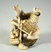 A JAPANESE CARVED IVORY OKIMONO, of a figure on a bucking horse, with another figure at his side,