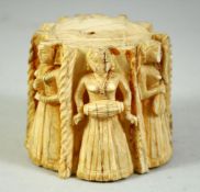 A FINE 18TH CENTURY INDIAN CARVED BONE STAND, depicting female musicians and dancers, 7cm high.