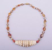 A TIBETAN AGATE BEADED NECKLACE.