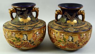 A PAIR OF JAPANESE GOSU BLUE SATSUMA TWIN HANDLE VASES, 24cm high.