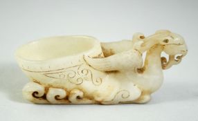 A GOOD CHINESE WHITE JADE PHOENIX LIBATION BOWL, of archaic form and design, 3.5in long & 1.5in