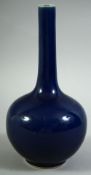 A CHINESE BLUE GLAZE PORCELAIN BOTTLE VASE, 22.5cm high.