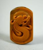 A CHINESE CARVED CORNELIAN PENDANT, 4cm.