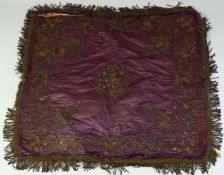 A 19TH CENTURY INDIAN PURPLE SILK TEXTILE, with braided edges, embroidered in silver and gilt