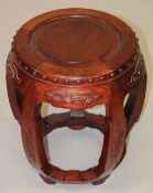 A CHINESE HARDWOOD BARREL SEAT.