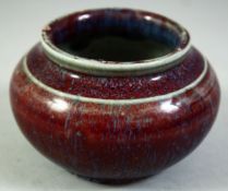 A CHINESE FLAMBE GLAZE BRUSH WASHER, 9cm diameter.