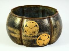 A JAPANESE GOLD LACQUERED BRONZE LOBED JARDINIERE, the exterior with applied Tokugawa Clan mon, 20cm