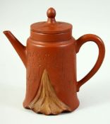 AN UNUSUAL CHINESE TALL YIXING TEAPOT, with incised calligraphy, the base and inner lid with