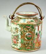 A CHINESE CANTON PORCELAIN TEAPOT, with panels figures and native flora, 13cm high.