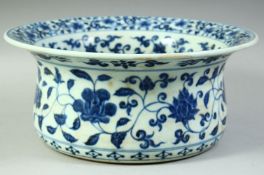 A LARGE CHINESE BLUE AND WHITE PORCELAIN WASHING BASIN, painted all over with bands of foliate