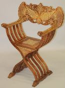 A GOOD BURMESE BONE AND EBONY INLAID FOLDING ARMCHAIR, the removable back panel formed and inlaid as