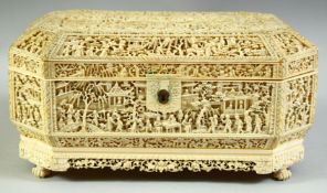 A SUPERB CHINESE CANTON CARVED IVORY SEWING BOX, finely carved all over with busy village scenes