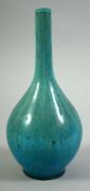 A CHINESE TURQUOISE GLAZED PORCELAIN BOTTLE VASE, 18.5cm high.