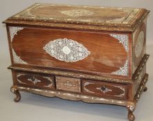 A LARGE CEYLONESE BONE INLAID COFFER / CASKET, raised on four curving wooden feet, 106cm wide,