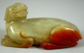 A CHINESE CARVED JADE MODEL OF A RECUMBENT BEAST, 6.5cm long.