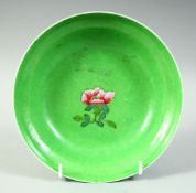 A 19TH CENTURY CHINESE GREEN GROUND FAMILLE ROSE PORCELAIN BOWL, the exterior with scrolling foliate