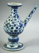 A CHINESE BLUE AND WHITE MING STYLE PORCELAIN WATER DROPPER, painted with floral decoration, the