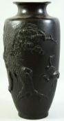 A SUPERB JAPANESE MEIJI PERIOD BRONZE RELIEF DECORATED VASE, the raised decoration depicting
