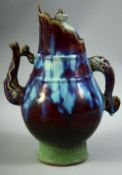 A CHINESE FLAMBE GLAZE WINE JUG AND COVER, with moulded beast handle and elephant type spout, 31cm