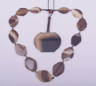 A GOOD AGATE NECKLACE, together with an agate pendant on string necklace.