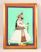 AN INDIAN MINIATURE PAINTING OF A NOBLEMAN - stood in his attire holding his stick - framed