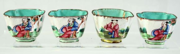 FOUR CHINESE ENAMELLED SALTS, each decorated with figures in an outdoor setting, 4.5cm diameter, (