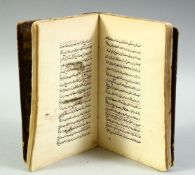 AN ISLAMIC LEATHER BOUND SCHOLAR'S ASTROLOGY BOOK, the book containing writings and various