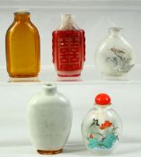 A MIXED LOT OF FIVE SNUFF BOTTLES, including a celadon glaze bottle, two reverse painted bottles and