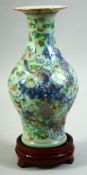 A CHINESE CELADON CLOBBERED PORCELAIN VASE, painted with exotic bird, butterflies and flora; with