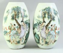 A PAIR OF EARLY 20TH CENTURY CHINESE FAMILLE VERTE VASES, decorated with figures beside a tree,