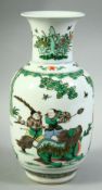 A CHINESE FAMILLE VERTE PORCELAIN VASE, painted with figures and foo dog / beast in an outdoor