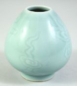 A CHINESE CELADON GLAZE BRUSH POT, the base with six character mark, 9cm high.
